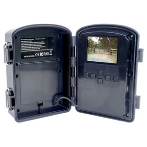 Outdoor surveillance camera with open cover showing screen and control buttons on a white background