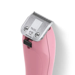 Pink hair clipper with metal blade on a white background