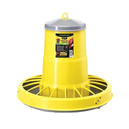 Yellow poultry feeder with a white background