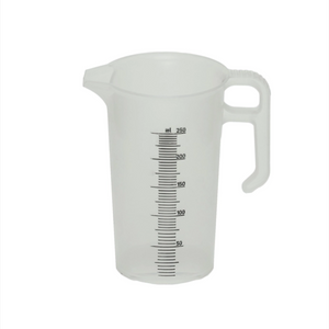 Clear plastic measuring cup with measurement markings on a white background