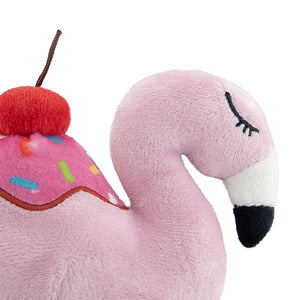 Plush toy flamingo with cherry on top against a white background