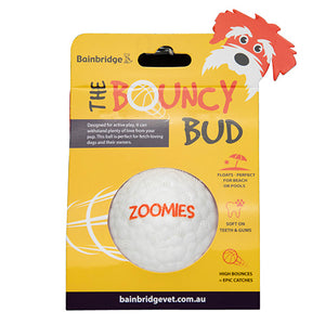 Packaging of a dog toy labeled 'The Bouncy Bud' with a cartoon dog illustration in yellow packaging.
