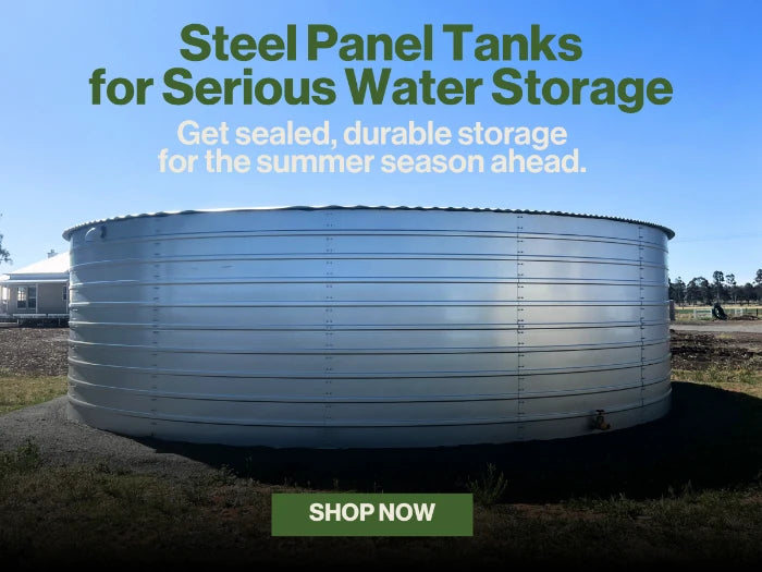Large metal water storage tank with text about steel panel tanks for water storage.