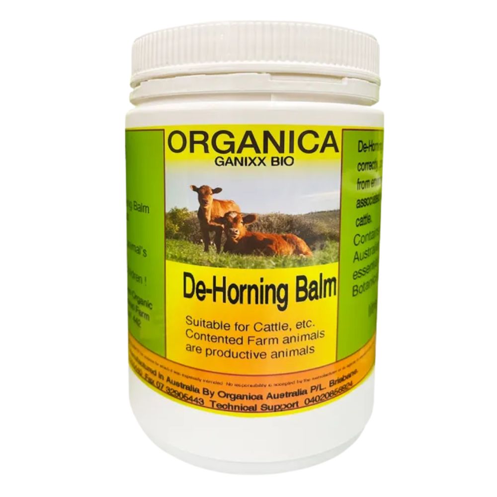 Organica de-horning balm container with label showing cows and branding