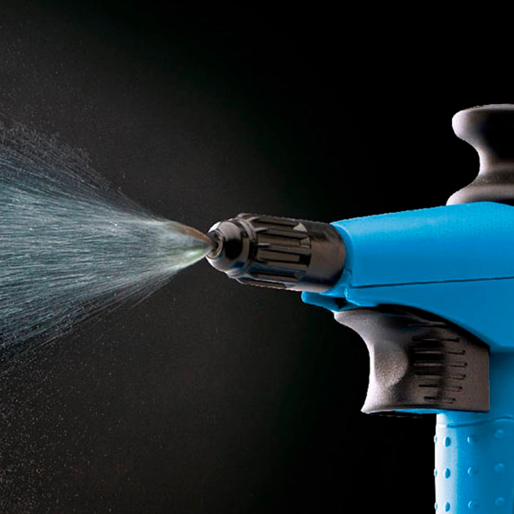 Blue spray gun with water being sprayed against a black background