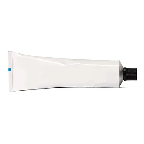 White tube of pink-eye patch adhesive with black cap on a white background