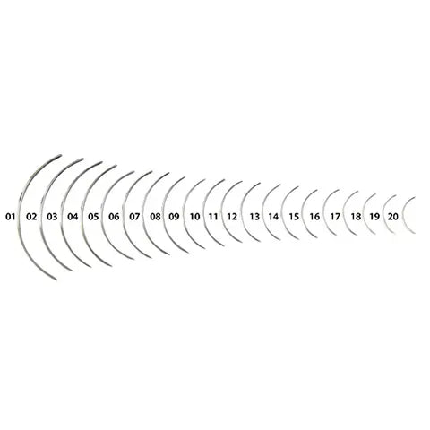 Set of 20 metal suture needles on a white background