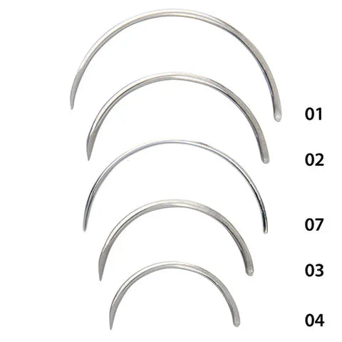 Set of five silver curved suture needles with numbers on a white background