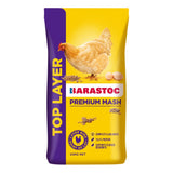 Barastoc Premium Mash Top Layer feed packaging with a chicken and eggs illustration on a yellow and purple background.