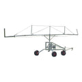 Metal agricultural irrigator on wheels with a white background