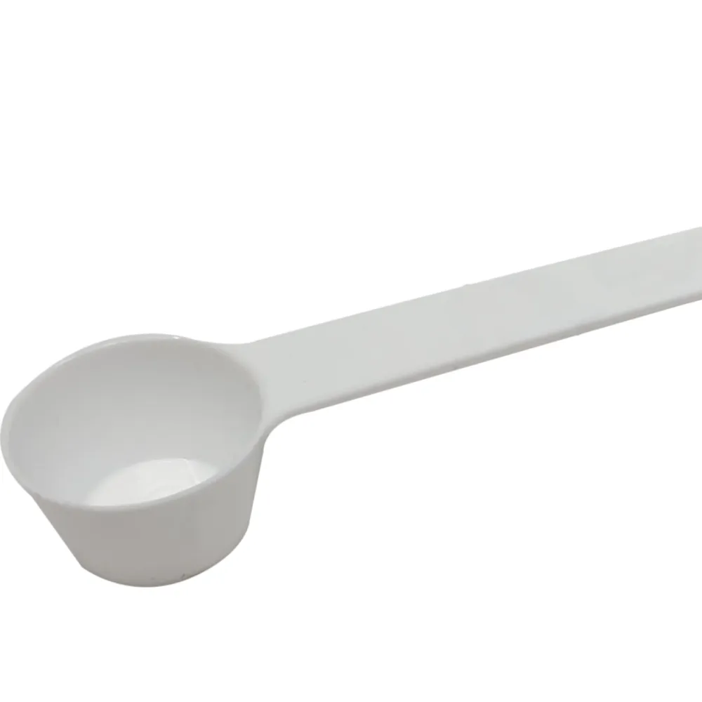 White feedmaxx spoon for herbicides on a white background