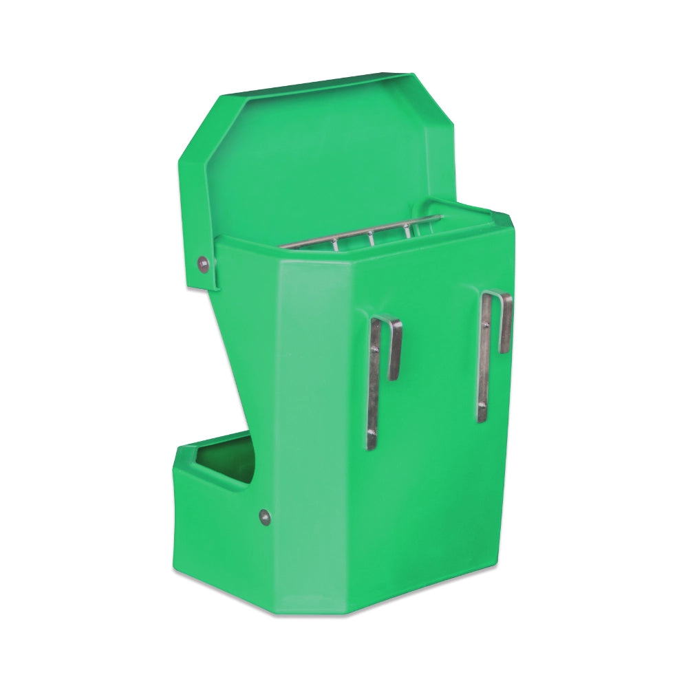 Green plastic horse feeder on a white background