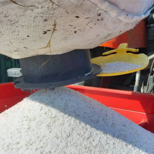 Close-up of a vidbag jumbo with grain being poured out of it.