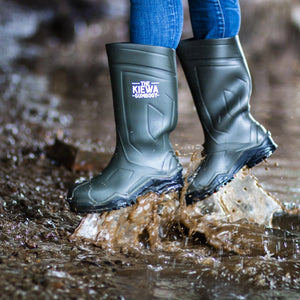 Person wearing green rubber boots with 'The Kiewa Company' logo walking through water.