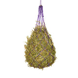 Hay net with hay hanging from purple ropes on a white background