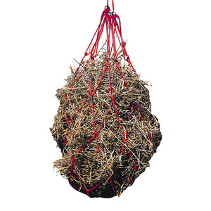 Hay net with hay inside on a white background