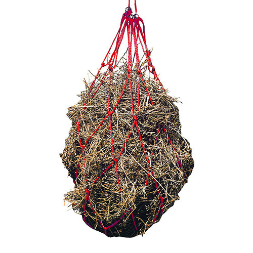 Hay net with hay inside on a white background