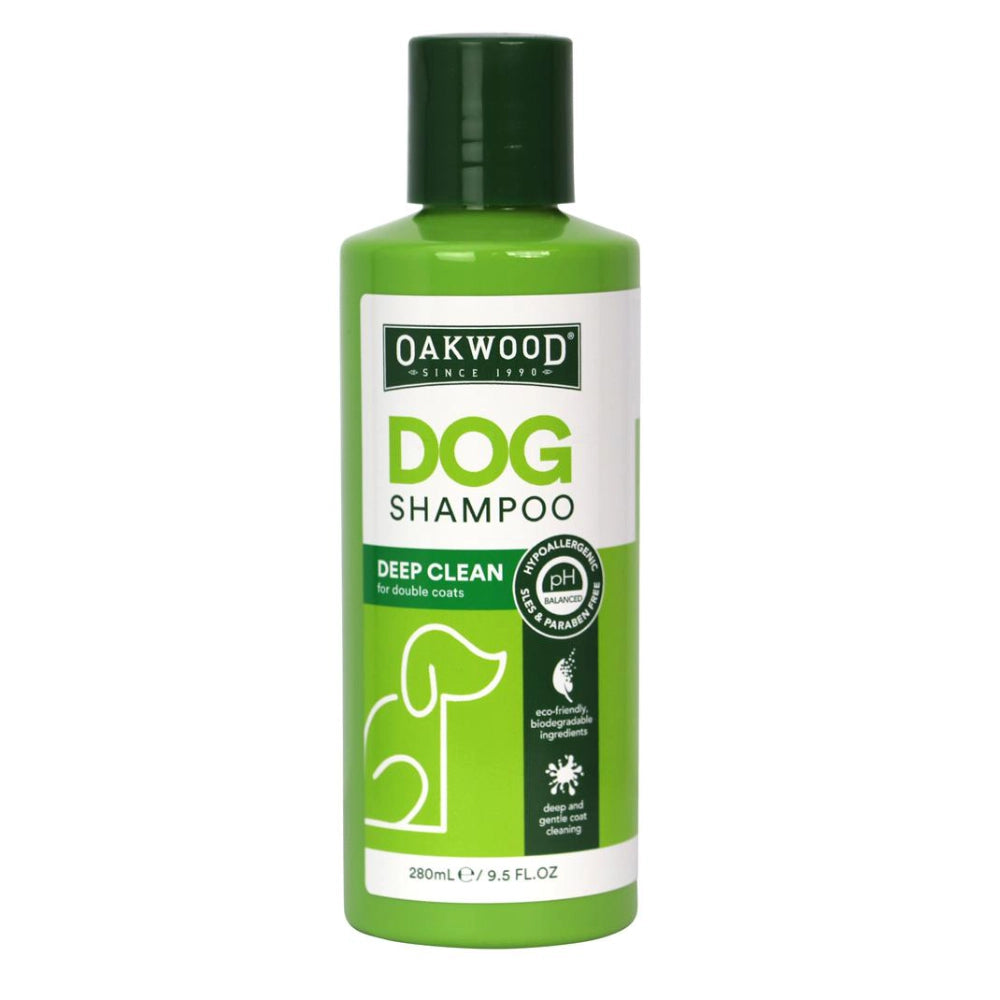 Green bottle of Oakwood Dog Shampoo on a white background