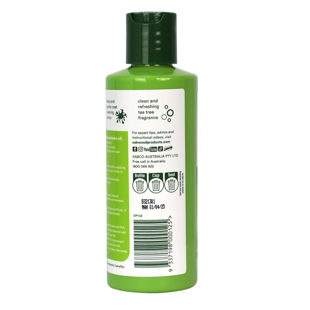 Green dog shampoo bottle with label on a white background