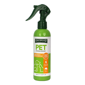 Green spray bottle labeled 'Oakwood Pet Stain & Odour' on a white background
