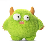 Green plush toy with large eyes and brown horns on a white background