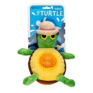 Plush turtle toy with avocado texture and sun hat packaging on a white background