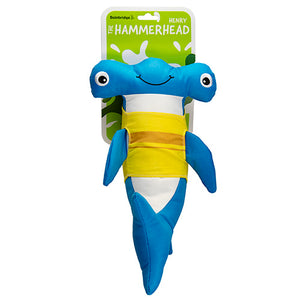 Blue and yellow shark-shaped toy with a green label on a white background