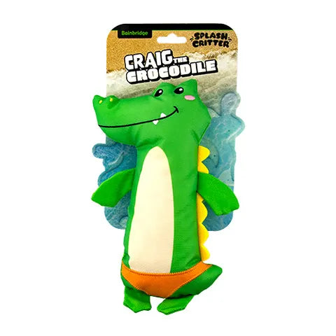 Plush toy crocodile with packaging labeled 'Craig the Crocodile' on a white background