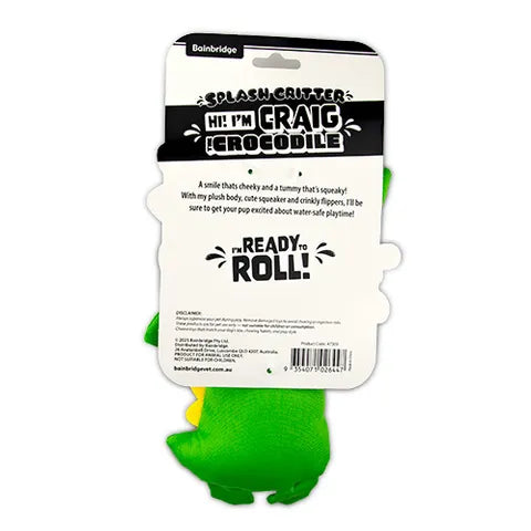 Green crocodile toy with packaging on a white background