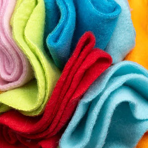 Stack of colorful felt sheets in various colors including pink, green, blue, red, and orange.