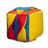 Colorful cube-shaped toy with red, yellow, and blue sides on a white background