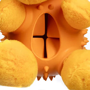 Orange and yellow textured dog toy with a central circular cutout on a white background