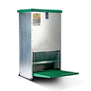 Metallic bird feeder with green base and top on a white background