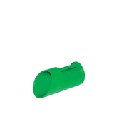 Green plastic feed scoop on a white background